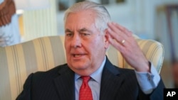 Secretary of State Rex Tillerson gestures during a interview with the Associated Press at the State Department in Washington, Jan. 5, 2018.