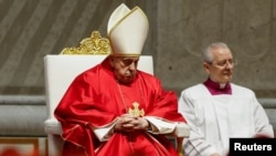 Pope Francis presides over the Good Friday Passion of the Lord service in Saint Peter's Basilica at the Vatican, March 29, 2024.
