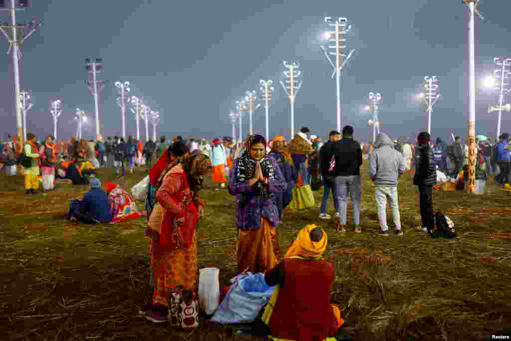Devotees gather on the day they take a holy dip at Sangam, the confluence of the Ganges, Yamuna and Saraswati rivers, during the "Maha Kumbh Mela", or the Great Pitcher Festival, in Prayagraj, India, Jan. 13, 2025.
