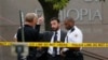 FILE - United States Secret Service police are seen standing in front of the Ethiopian Embassy in Washington Sept. 29, 2014, in connection with a shooting incident at the compound.