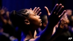 In this Saturday, July 6, 2019 photo, an AileyCamper rehearses the opening routine for a performance later that night at the Clayton County Performing Arts Center in Jonesboro, Ga. Some dancers had never received professional training prior to attending t