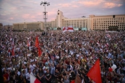 FILE - Opposition supporters protest against disputed presidential elections results at Independence Square in Minsk, Belarus, Aug. 18, 2020.