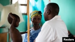 A child with measles infection at an isolation war in Congo.