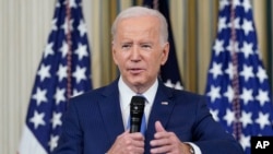 FILE - President Joe Biden answers questions from reporters as he speaks in the State Dining Room of the White House in Washington, Nov. 9, 2022.