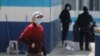 Guatemalan migrants who arrived in the country on U.S. deportation flights wear protective masks at a temporary shelter, as the spread of the coronavirus disease (COVID-19) continues in Guatemala City, April 18, 2020.