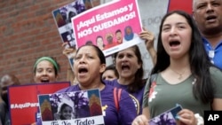 Protesters gather outside federal court in Boston, Aug. 14, 2019, to protest the Trump administration's campaign to end temporary protected status, or TPS, for tens of thousands of immigrants nationwide. On Friday, TPS was extended for six countries.