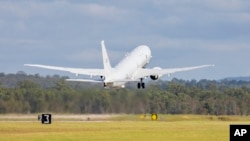 In this photo provided by the Australian Defense Force, a Royal Australian Air Force P-8 Poseidon aircraft departs an airbase in Amberly, Australia, Jan. 17, 2022, to assist Tonga after the eruption of an undersea volcano. (LACW Emma Schwenke/ADF via AP)