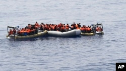 This undated image made available on May 30, 2016 by the Italian Navy Marina Militare shows migrants being rescued at sea. Survivor accounts have pushed to more than 700 the number of migrants feared dead in Mediterranean Sea shipwrecks over three days in the past week, even as rescue ships saved thousands of others in daring operations. 