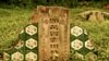 A dilapidated gate at the historic Bukit Brown Cemetery, home to 100,000 traditional Chinese graves. (VOA/K. Lamb)