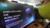 FILE - A woman checks the website of Israel-made Pegasus spyware at an office in the Cypriot capital Nicosia on July 21, 2021. Israel-made Pegasus spyware was used to monitor activists, journalists and politicians around the world.