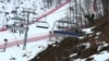 Snow and brown patches are seen near the alpine course at the Sochi 2014 Winter Olympics, Krasnaya Polyana, Russia, Feb. 11, 2014.