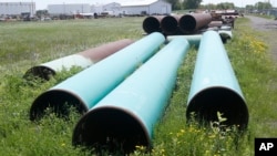 Pipeline used to carry crude oil is shown at the Superior terminal of Enbridge Energy in Superior, Wis, June 29, 2018. 