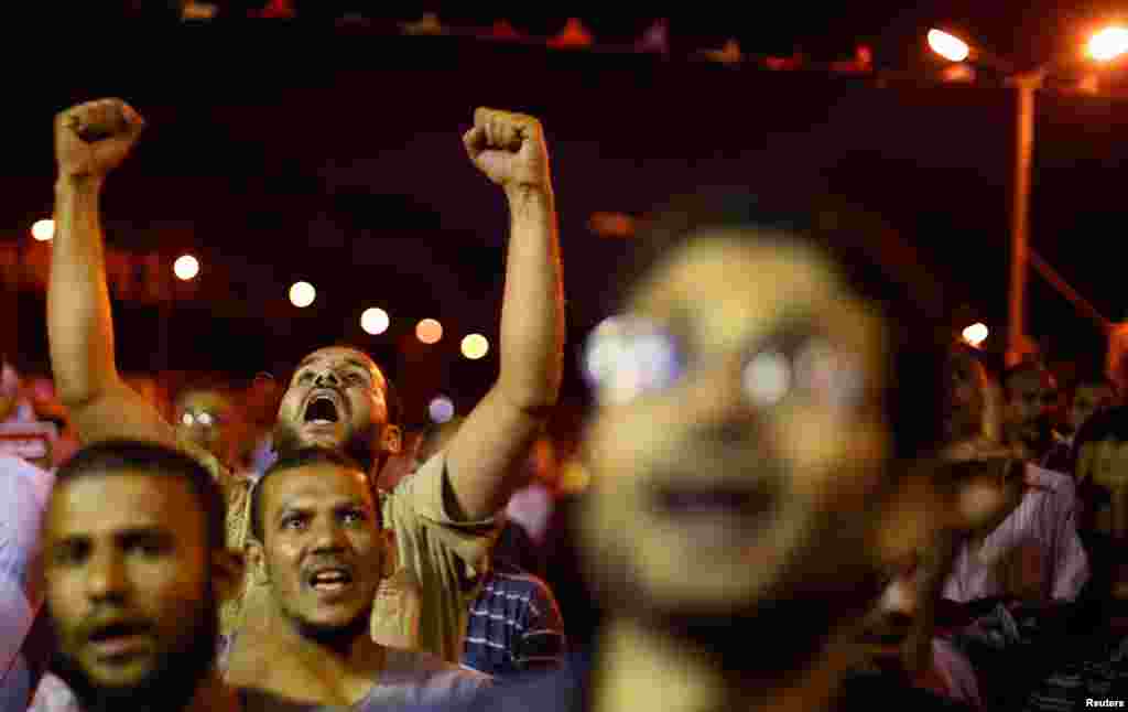 Supporters of the ousted Egyptian President Mohamed Morsi shout anti-army slogans during a sit-in protest in Cairo July 11, 2013.