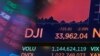 A board above the trading floor of the New York Stock Exchange shows the closing number for the Dow Jones Industrial Average, July 19, 2021. 