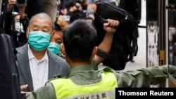 FILE - Media mogul Jimmy Lai, founder of Apple Daily, leaves the Court of Final Appeal by prison van in Hong Kong, China, Feb. 9, 2021. 