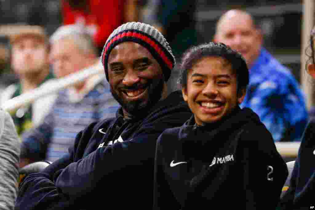 Former NBA star Kobe Bryant attends an NCAA women's college basketball game between Long Beach State and Oregon, Dec. 14, in Long Beach, Calif.