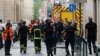 Para petugas pemadam kebakaran dan medis terlihat di lokasi pasca ledakan di Lyon, Perancis, Jumat (24/5). 