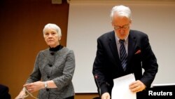 FILE - Paulo Pinheiro, Chairperson of the Commission of Inquiry on Syria, arrives with Karen Abuzayd, member of the Commission before the launch of their report on sexual and gender-based violence in Syria at the United Nations office in Geneva, Switzerland, March 15, 2018.