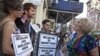 Linda Jacknow, 70, of Long Island, N.Y., right, an opponent of the proposed Islamic center and mosque to be built near Ground Zero argues against Aviva Stampfer, 21, of Manhattan, N.Y., left, and Blake Luley, 23, of Brooklyn, N.Y., both in favor of the p