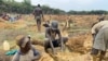 Rescue workers install a pump to drain water from a collapsed mineshaft at Ran Mine, in Bindura, Zimbabwe, Nov. 26, 2020.