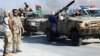 Soldats de l'armée nationale libyenne au port pétrolier de Sidra à Ras Lanouf, en Libye, le 21 juin 2018.