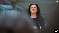 FILE - Facebook chief operating officer Sheryl Sandberg delivers a speech during a start-up companies meeting in Paris, France, Jan. 17, 2017.