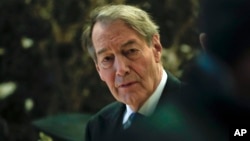 FILE - TV news anchor Charlie Rose walks through the Trump Tower in New York, Nov. 21, 2016. 