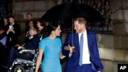 FILE - Britain's Prince Harry and Duchess of Sussex Meghan arrive at the annual Endeavour Fund Awards in London, March 5, 2020. 