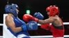 Ramla Said Ahmed Ali of Somalia in action against Claudia Nechita of Romania in women's featherweight boxing in Tokyo, Japan, July 26, 2021.