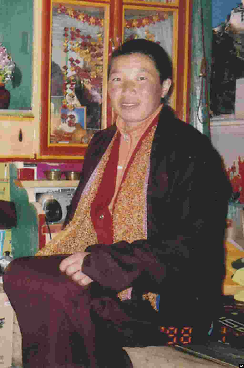 Tibetan Buddhist nun Palden Choetso sits in a house. The 35-year-old Tibetan Buddhist nun burned herself to death on a public street an hour's drive away on November 3, 2011, the latest in a string of self-immolation to protest against Chinese religious c