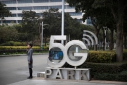 A Huawei employee on Huawei's campus in Shenzhen in southern China's Guandong Province, Dec. 5, 2019. The Chinese tech giant is asking a U.S. federal court to throw out a rule that bars rural phone carriers from using government money to purchase its equipment.
