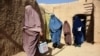 Afghan women from a polio immunization team carry out a vaccination campaign in Kandahar, Oct. 15, 2019. Polio immunization is compulsory in Afghanistan, but distrust of vaccines is rife, and the programs are difficult to enforce in rural areas.