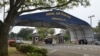 FILE - The main gate at Naval Air Station Pensacola is seen on Navy Boulevard in Pensacola, Fla., March 16, 2016.