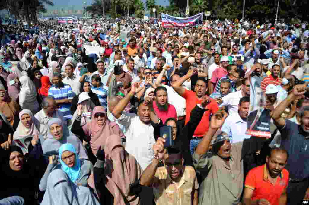 Supporters of Egypt's ousted president Mohamed Morsi chant slogans as they demonstrate in Egypt's northern coastal city of Alexandria, against security forces clearing two pro-Morsi protest camps in Cairo. Aug. 14, 2013