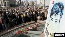 People take part in a rally in central Kyiv, Ukraine, demanding liberation of Ukrainian army pilot Nadezhda Savchenko by Russia, March 6, 2016.