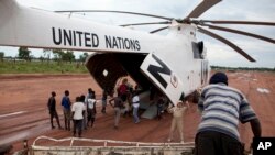 FILE - A World Food Program (WFP) truck backs up to load food items from a recently landed UN helicopter, in Yida camp, South Sudan. Ban's visit comes as implementation of the peace agreement signed last August between President Salva Kiir and his former vice president, Riek Machar, is proceeding only slowly. 