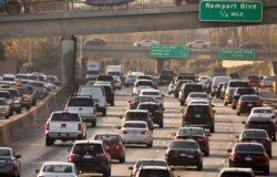 FILE - Traffic flows on the Hollywood Freeway in Los Angeles, Dec. 12, 2018.