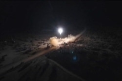 FILE - An image grab from video obtained from the state-run Iran Press news agency allegedly shows rockets launched by Iran against U.S. military bases in Iraq on Jan. 8, 2020.