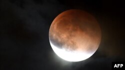 FILE - An eclipsed supermoon is shown on September 27, 2015 in Burbank California.