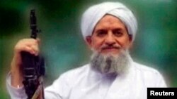 FILE - A photo of al-Qaida's leader, Ayman al-Zawahiri, is seen in this still image taken from a video released in September 2011. The leader of al-Qaida has called for attacks on Saudi Arabia after the kingdom's mass execution of 47 people in January.