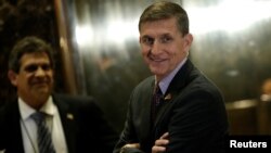 FILE - Retired U.S. Army Lieutenant General Michael Flynn stands by the elevators as he arrives at Trump Tower where U.S. President-elect Donald Trump lives in New York.