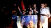 Supporters of Afghan presidential candidate Ashraf Ghani celebrate on the street after he was named president-elect in Kabul, September 21, 2014.