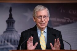 FILE - Senate Majority Leader Mitch McConnell, R-Ky., talks to reporters at the Capitol in Washington, June 27, 2019.