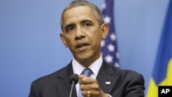 President Barack Obama gestures during joint news conference with Swedish Prime Minister Fredrik Reinfeldt, Sept. 4, 2013, in Stockholm, Sweden.