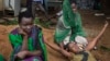 FILE - Relatives of Samual Moro, 30, grieve after he died of cholera, outside the cholera isolation ward at the Juba Teaching Hospital in the capital Juba, South Sudan.