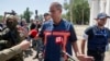 Peter Van Vilet, team leader of Holland's National Forensic Investigations Team speaks to media after inspecting a refrigerated train loaded with the bodies of passengers in Torez, eastern Ukraine, July 21, 2014.