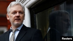 FILE - WikiLeaks founder Julian Assange makes a speech from the balcony of the Ecuadorian Embassy, in central London, Britain, Feb. 5, 2016.