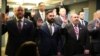 A group of military veterans take the oath at a U.S. Immigration and Customs Enforcement (ICE) ceremony, swearing them in to serve as analysts on child exploitation cases, at ICE headquarters in Washington, March 31, 2017. (B. Hamdard/VOA)