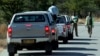 FILE - Zimbabwean policemen are seen stopping a group of cars on the outskirts of Mawabeni, Zimbabwe, June 6, 2008.
