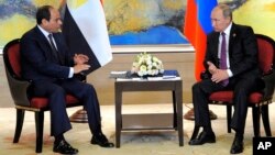 FILE - Russian President Vladimir Putin, right, and Egyptian President Abdel Fattah el-Sissi hold a bilateral meeting on the sidelines of a BRICS Summit in Xiamen, China, Sept. 4, 2017.